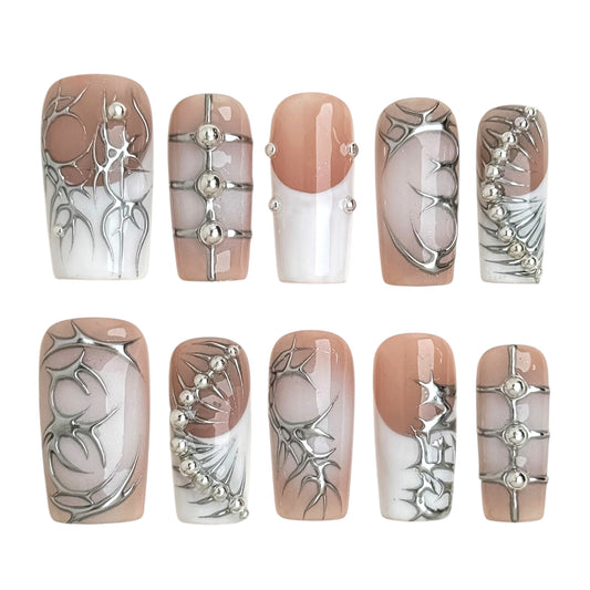Épine Blanche nude chrome press-on nails with sculpted silver lines, metallic relief details and futuristic hot girl aesthetic by NailMusee