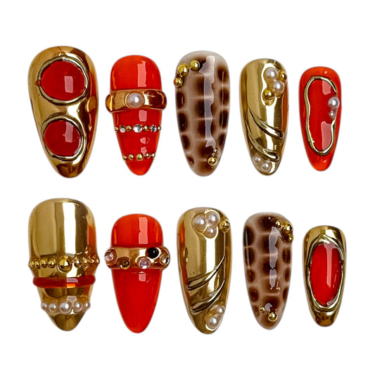 Ongles press-on Ambre Miel aux tons ambre et miel, finition résine brillante et détails dorés.