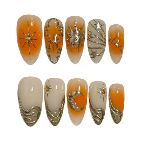 Asteria par NailMusee – ongles press-on orange dégradé avec soleil et étoiles