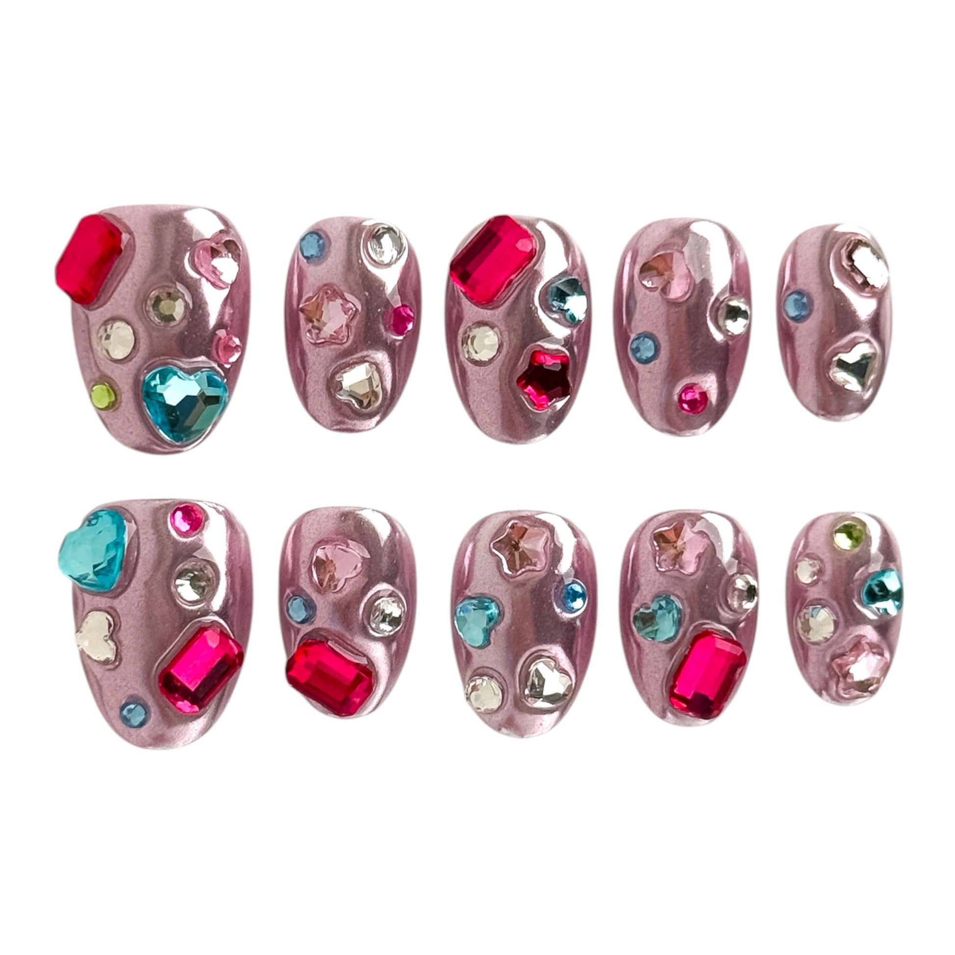 Pink chrome press-on nails with colorful crystal gems by NailMusee in a Y2K luxury style