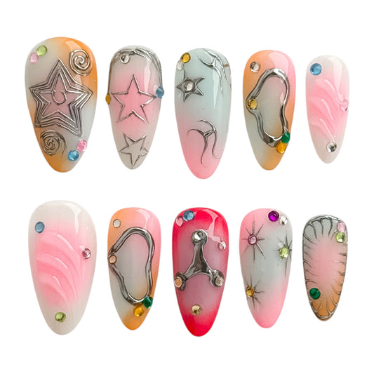 Disco Star press on nails longs faits main avec étoiles argentées, strass colorés et dégradés rose orange bleu