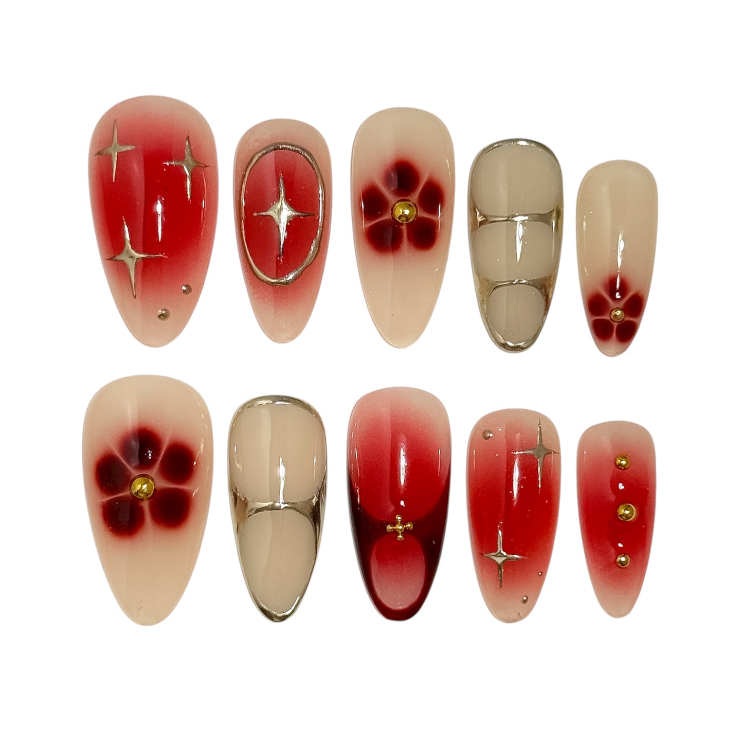 Rouge Bohème press-on nails set with red and nude gradient, golden accents and floral details